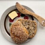 sesame sourdough roll with butter